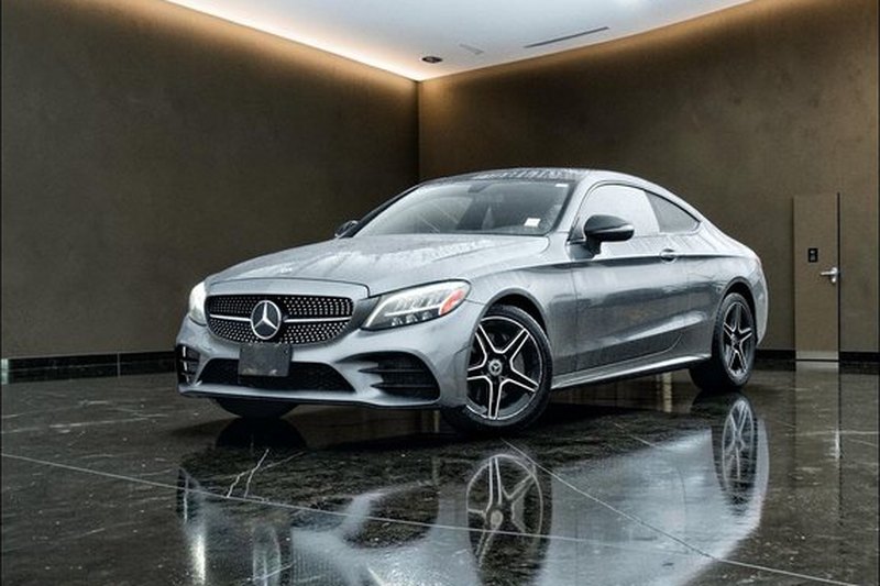 The same Mercedes-Benz C300 placed on a clean studio background with a floor reflection.