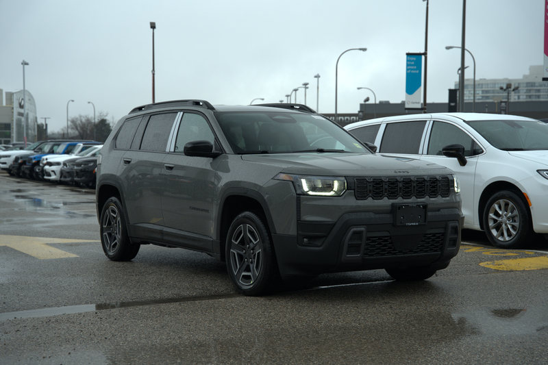 The same 2026 Jeep Cherokee straight off the camera, flat and underexposed on an overcast day.
